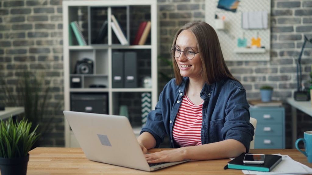 Businesswoman working on a laptop at an office desk